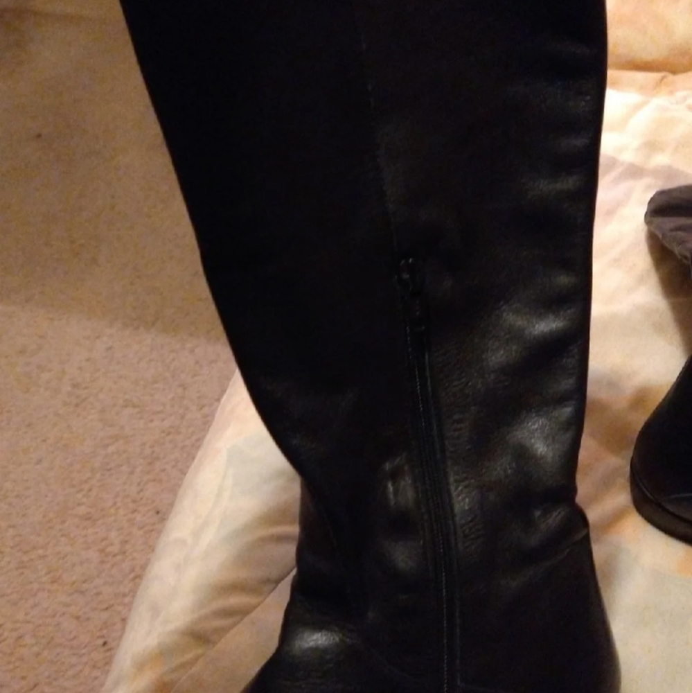 Knee high leather boots.